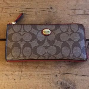 Coach accordion zip-around wallet with red accents